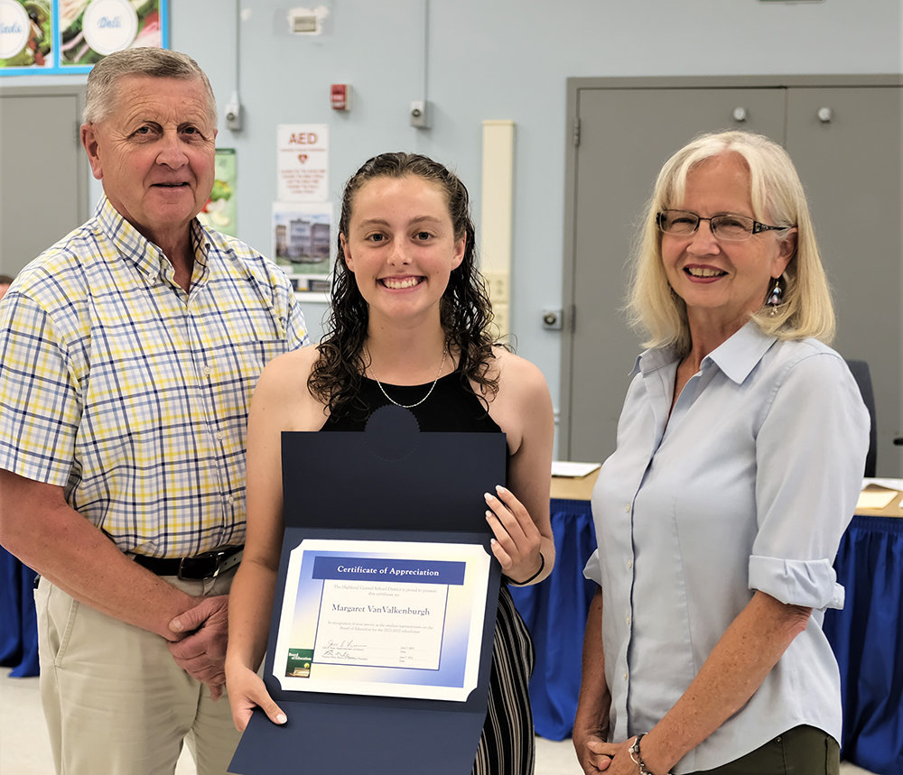Margaret Van Valkenburgh was honored for her service as the Student Representative to the school board. She is pictured with school board President Tom Miller and VP Sue Gilmore.